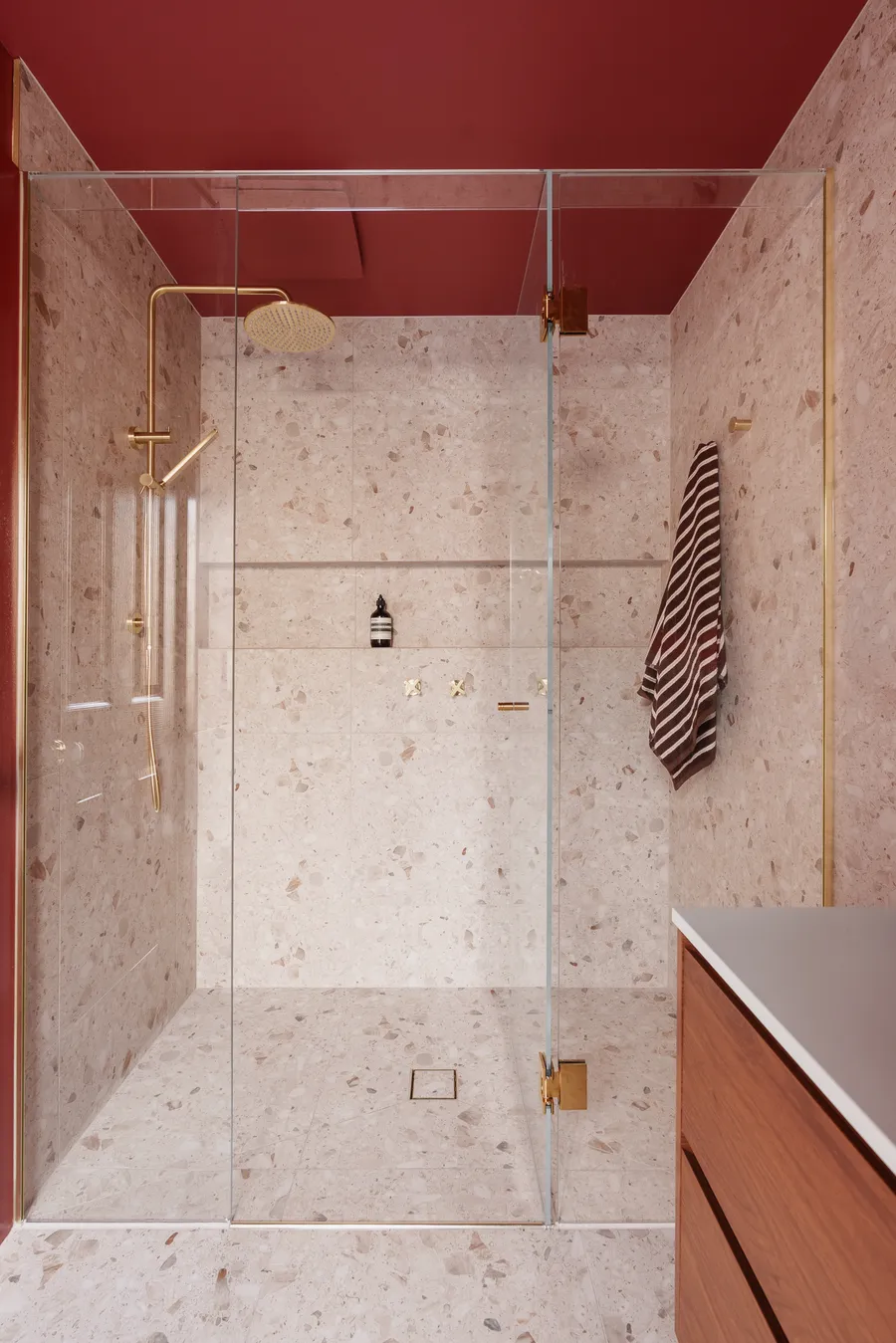 Recessed shower with terrazzo tiling and brass fittings, Grange Drive by MNA Builds